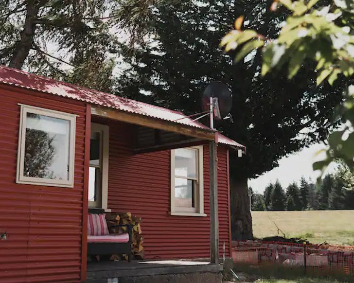 A rustic red hut in Lake Tekapo. 