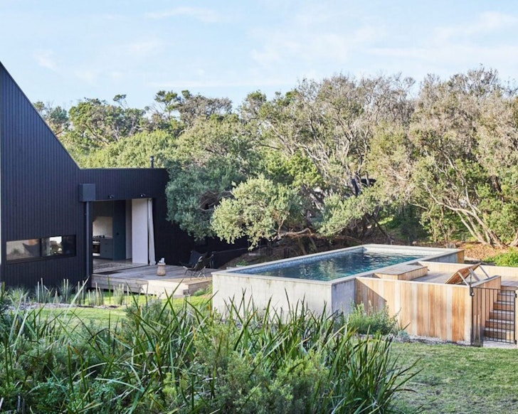 The pool and garden at The Bach one of the best beach house Airbnbs Victoria