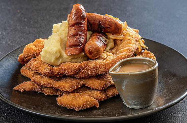 A loaded shnitzel with sausages from The Bavarian.