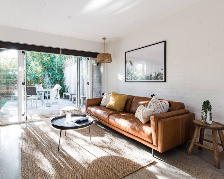 The living space and outdoor area at The Beach Bungalow one of the best Noosa Airbnbs