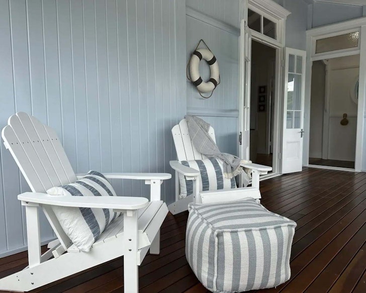 Two chairs on the deck at Restored Queenslander Cottage pet-friendly Airbnb Brisbane