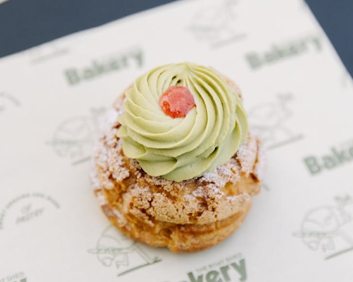 A gorgeous choux pastry topped with a green matcha swirl. 