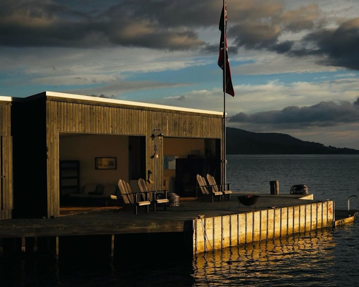 A view of the Boathouse at Satellite Island from the water