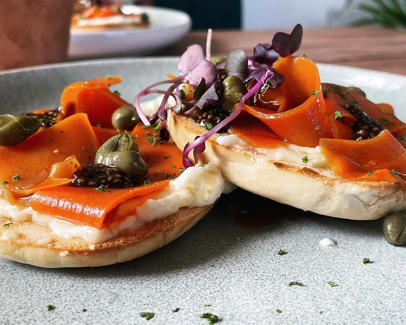 A stunning smoked salmon and cream cheese bagel at The Botanist, one of the best breakfasts in Lyall Bay, Wellington.