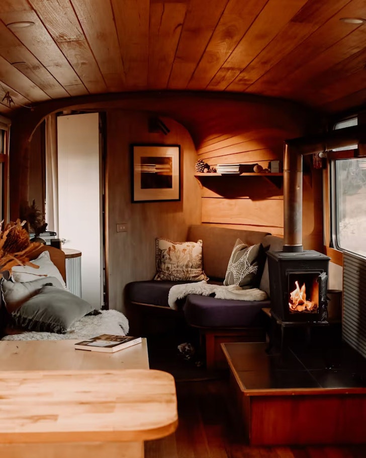The cosy interior of the Bus Home one of the best Launceston Airbnbs