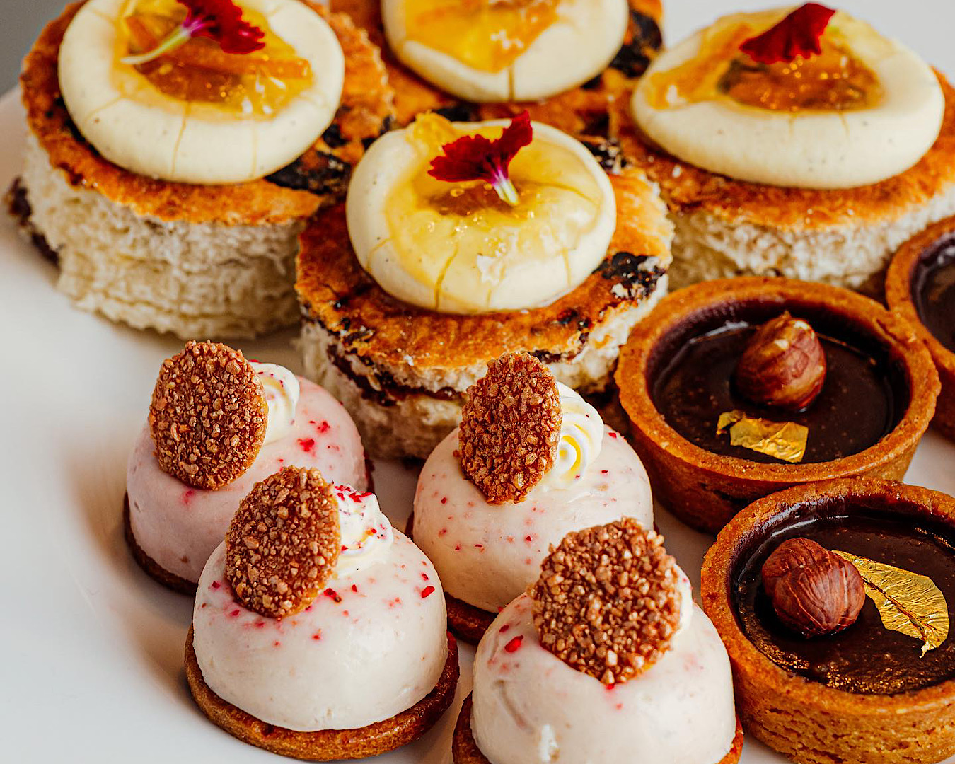 An assortment of dainty (and delicious) pastries at High Gin at The Churchill, one of the best things to do this Father’s Day. 