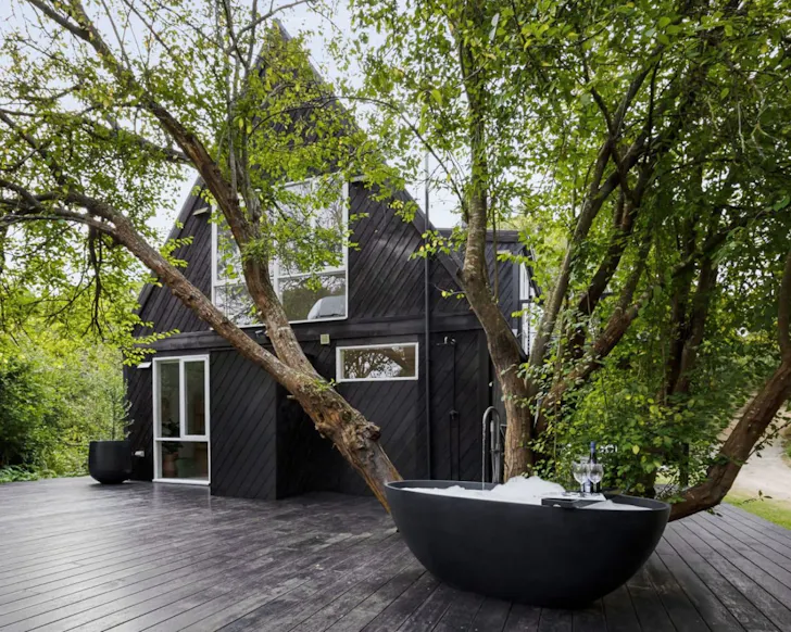 The outdoor bath at The Coast & Country Cottage one of the best Airbnbs with spas and outdoor baths Victoria