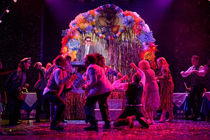 People performing on stage.