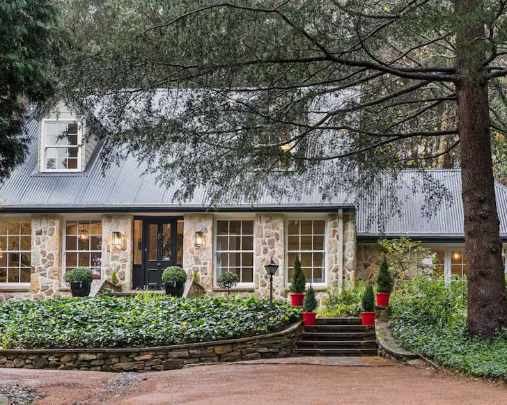 An exterior view of The Croft stone cottage Airbnb for large groups NSW