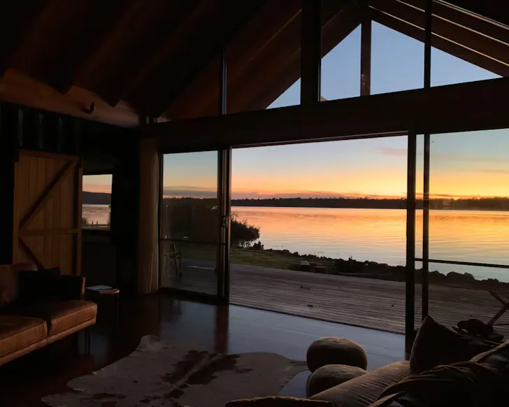 A view of the lake out the window of The Doctor's House one of the best Airbnbs in Tasmania