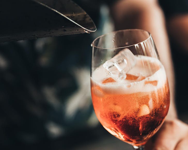 Sangria being poured into a wine glass at The Grangeâs bottomless Great Long Lunch in Takapuna. 
