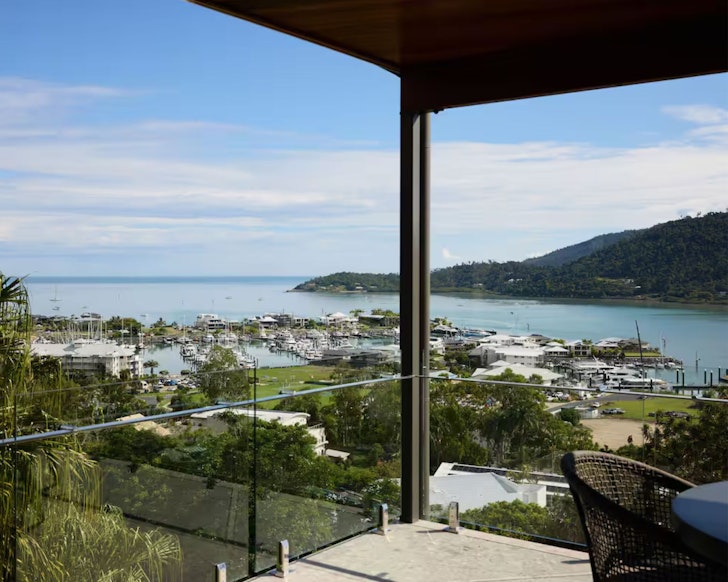 A view over the marina from the balcony at The Green Villa at Elementa one of the best Airlie Beach Airbnbs