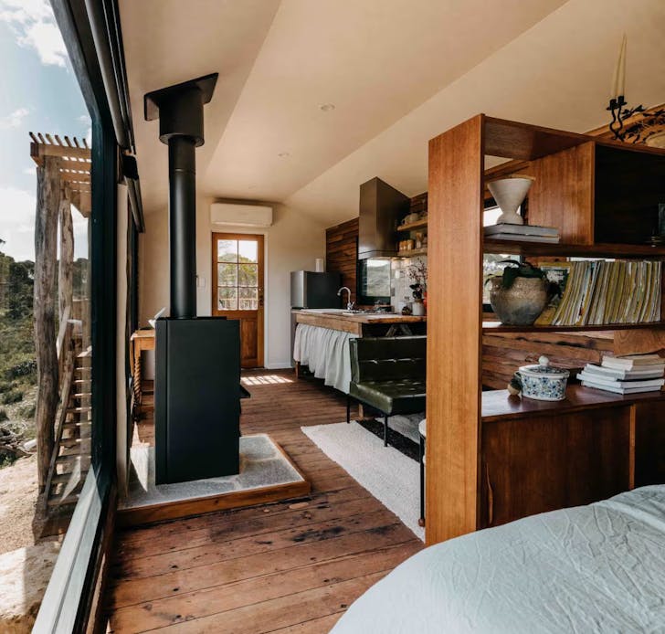 The living space at Greenly Carriage with wood burner in South Australia