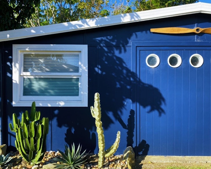 The blue exterior of The Hangar one of the best Gold Coast romantic getaways