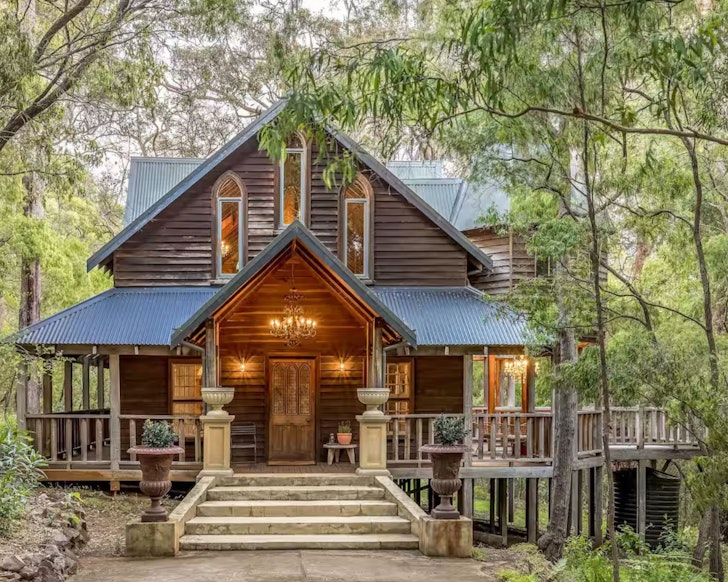 An exterior view of The Hide at La Foret with a chandelier at the entrance, one of the best romantic getaways in Australia