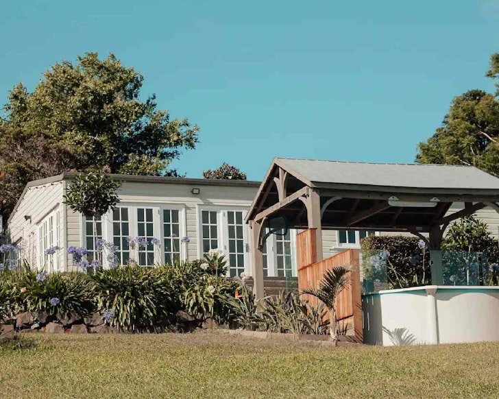Cottage exterior with plunge pool in the foreground