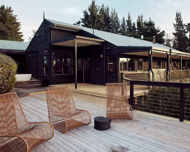 A view of the Lodge Cabin with chairs outside in NSW