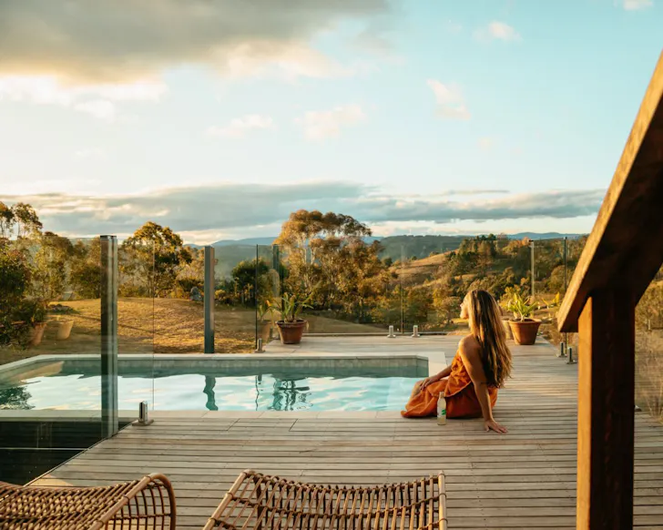 A view of the pool and countryside at The Lodge one of the best NSW Airbnbs