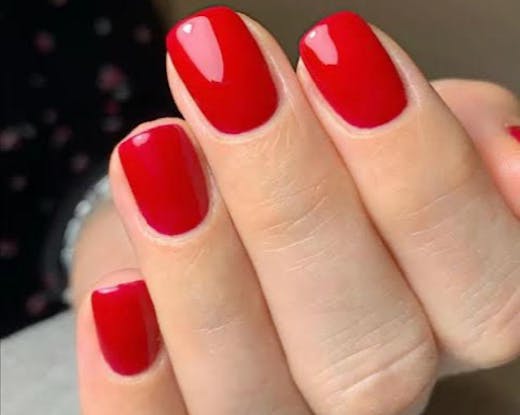 Perfectly square-manicured red nails