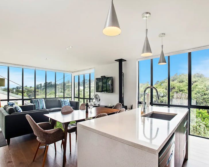Open plan kitchen at palm beach treehouse on Waiheke Island with panoramic views