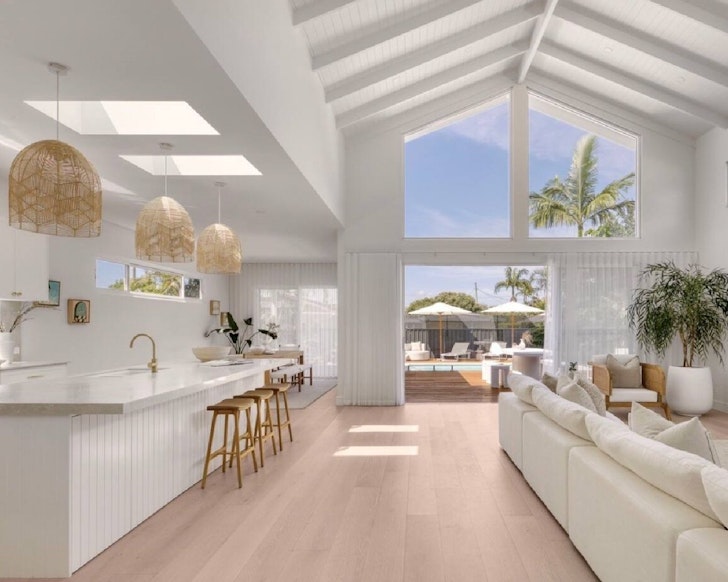 Open plan living room with high ceiling