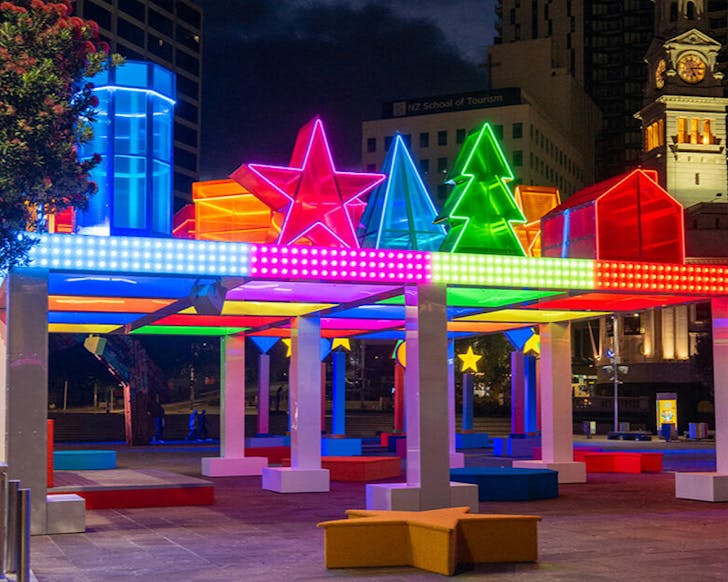 A pavilion made from giant neon shapes. 