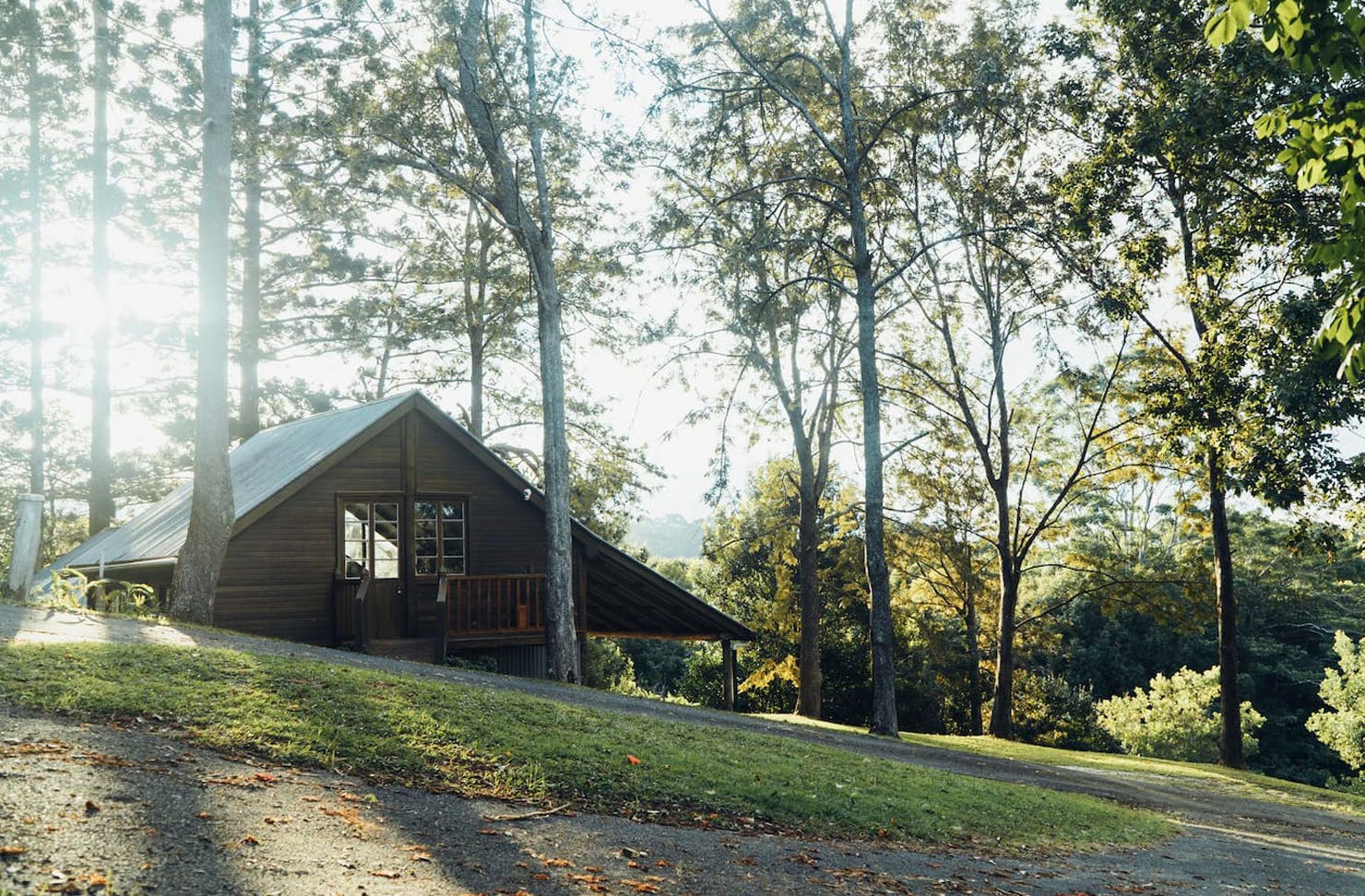 A timber A-frame sits on a farm in the Noosa Hinterland.