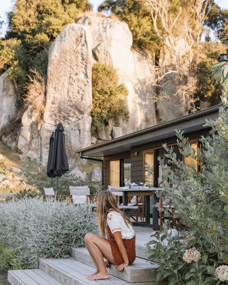 A guest outside The Rocks best winter cabins New Zealand