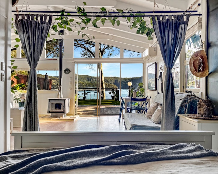 A view of the water from the bed at The Sea Shanty best NSW beach house Airbnbs