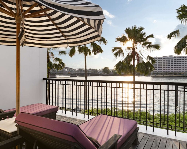 Two loungers and an umbrella at The Siam one of the best Bangkok hotels