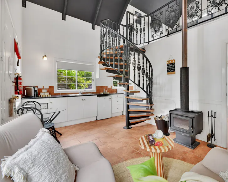 The lounge with its spiral staircase at The Silky Oak best accommodation Stanthorpe