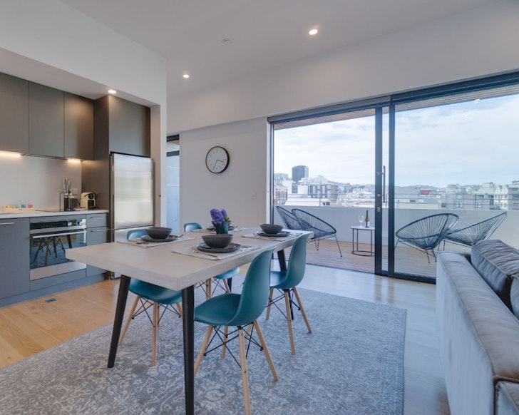 The living space with a view at The Swan Penthouse one of the best Wellington Airbnbs