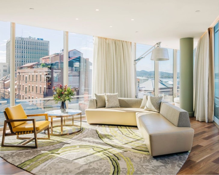 The living space in a room overlooking the water at The Tasman Hotel one of the best hotels in Australia