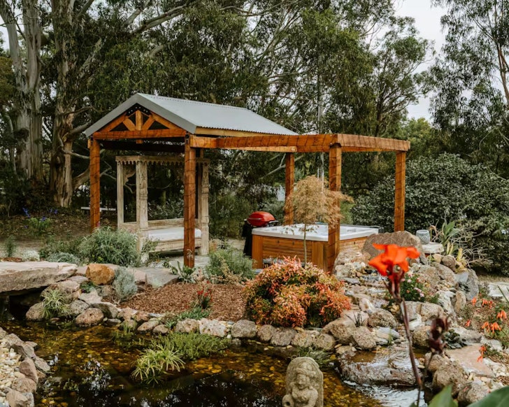 The outdoor spa under the pergola at The Temple 
