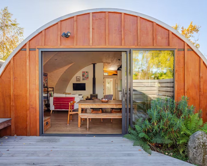 The moon-shaped exterior of the Tunnel House one of the best accommodation options in Wanaka New Zealand