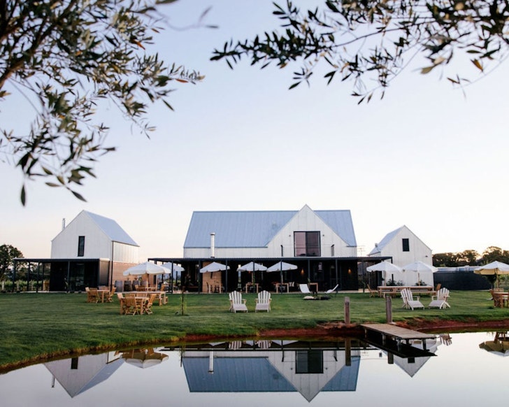 A view across the lake to The Vine Loft By Yeates Wines best NSW farm stays