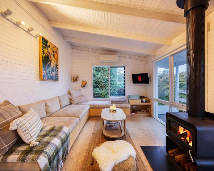 The cosy living space with fire at The Wanderer romantic accommodation Victoria