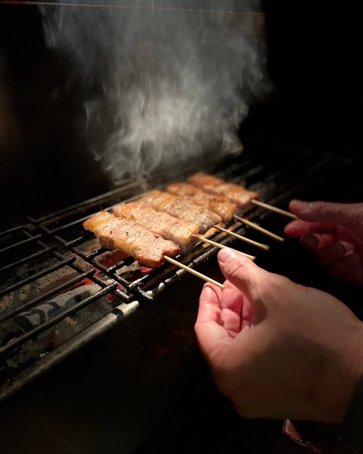 Yakitori skewers getting the flame treatment at The Yakitori House, one of the best Japanese restaurants in Auckland.