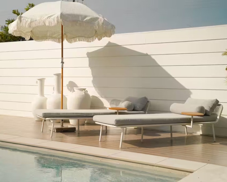 Sunloungers by the pool at Three Palms Escape one of the best Gold Coast pet-friendly stays