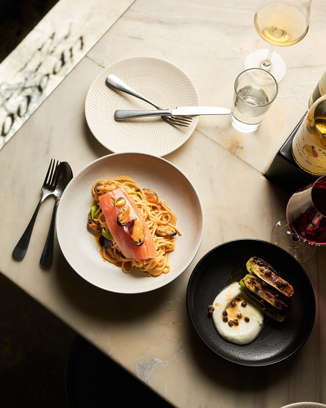 Two plates of pasta in large white bowls at one of the best restaurants in Melbourne, Tipo 00.