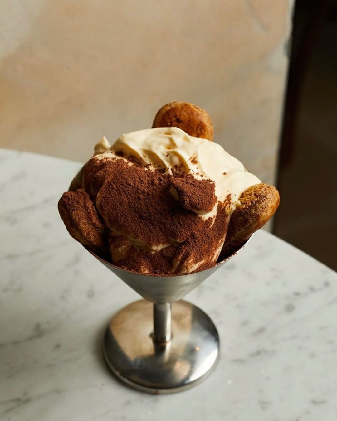 A perfect tiramisu Melbourne in a large stainless steel sundae cup. 