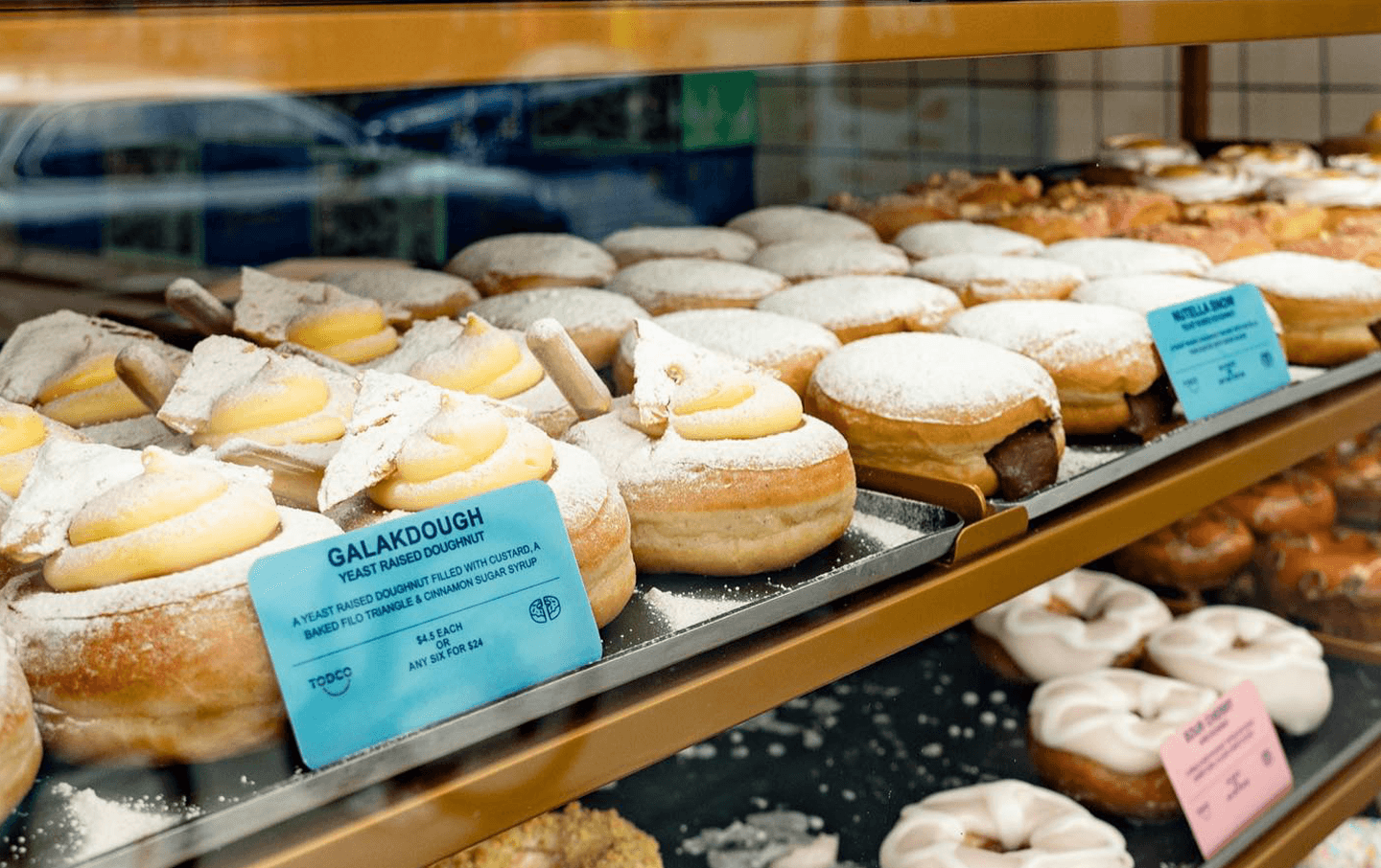 A display cabinet filled with a collection of the best donuts Melbourne. 