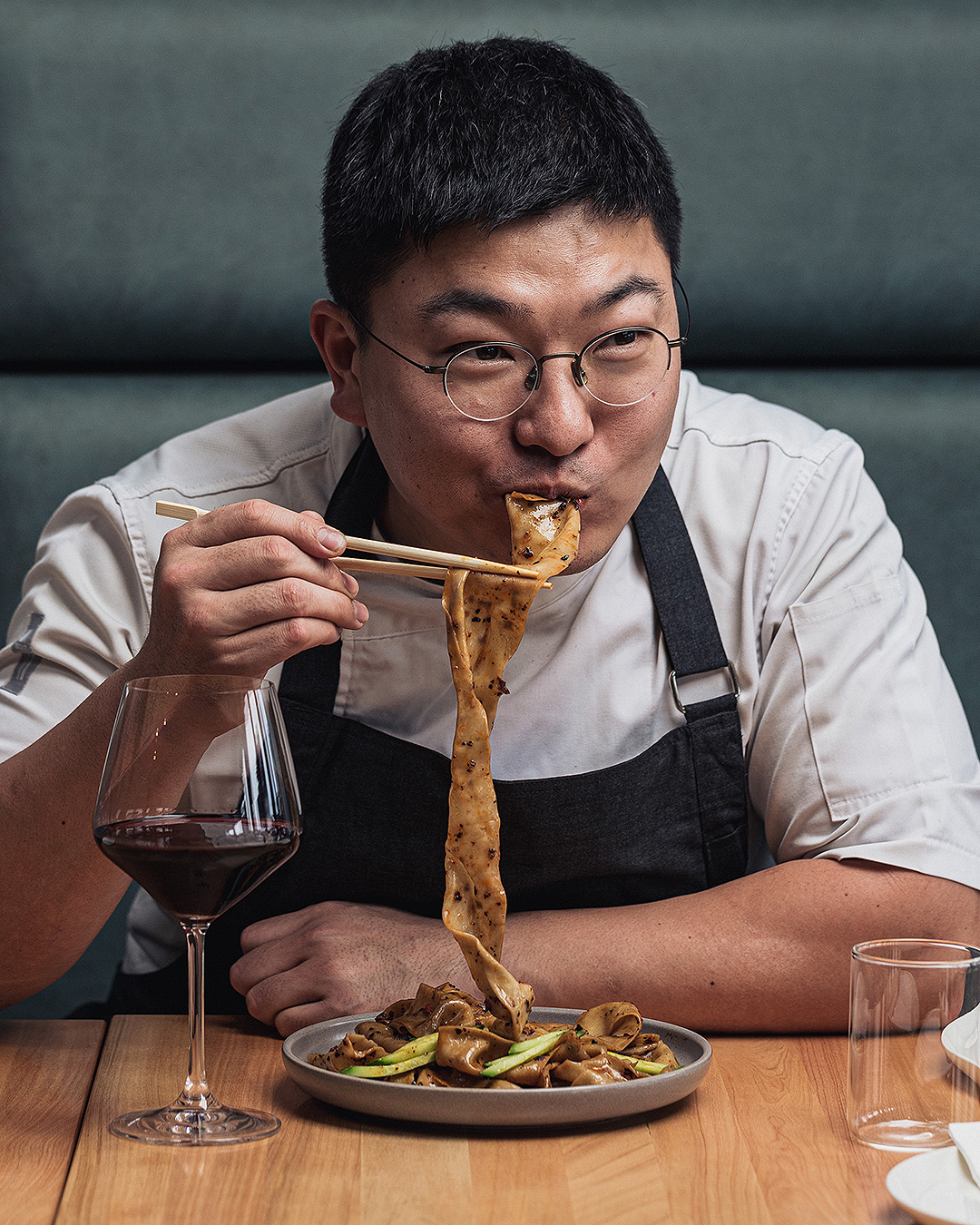 Chef Jason Kim enjoys noodles at his Milford restaurant Tokki.