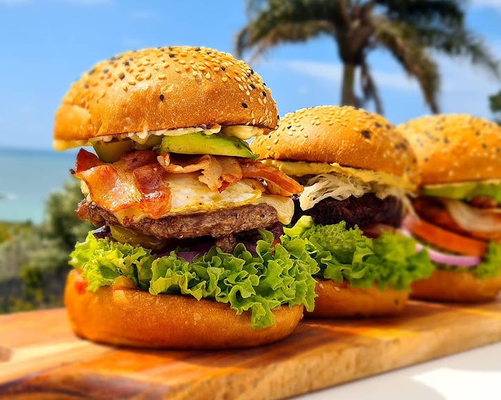 Burgers in a row at Too Fat Buns.