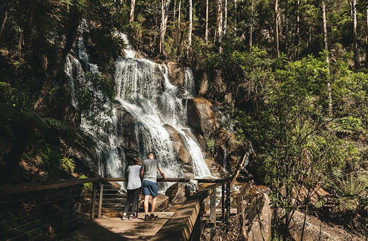 A couple at Toorongo and Ampitheatre Falls after a hike from the free campground in Noojee.