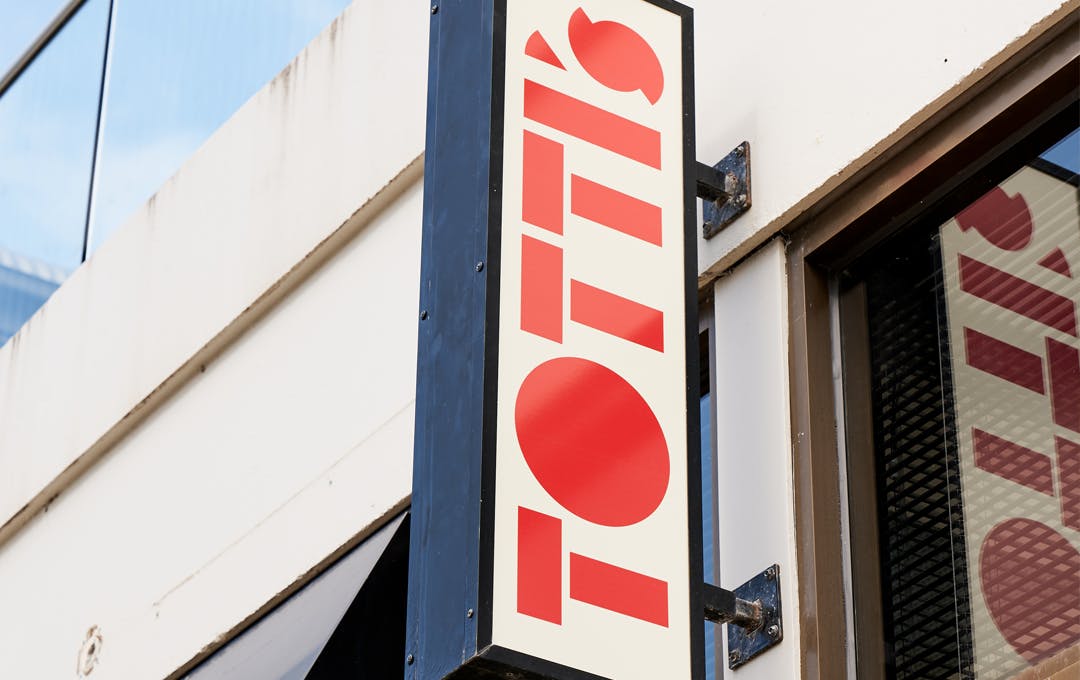 A red sign that reads 'Totti's' 