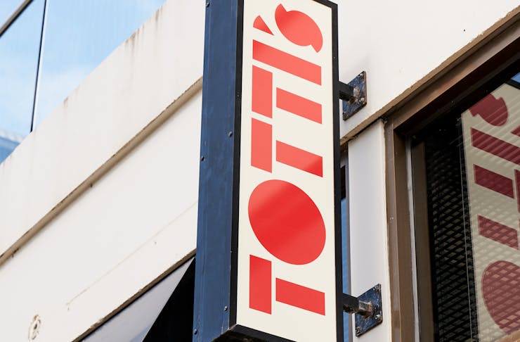 A red sign that reads 'Totti's' 