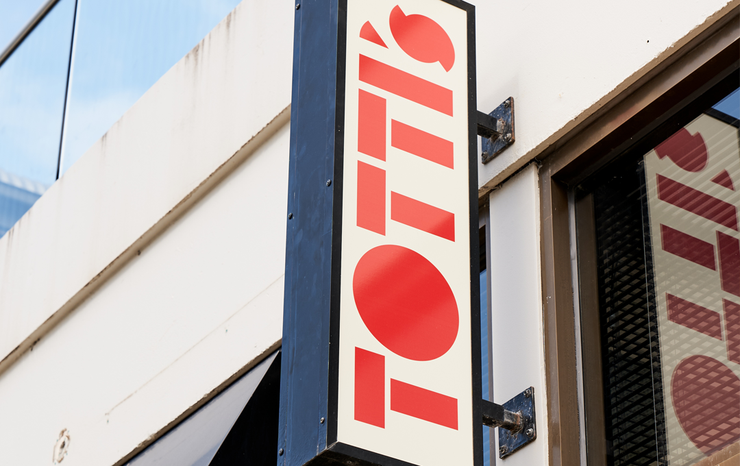 A red sign that reads 'Totti's' 