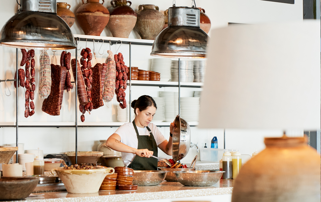 A person serving food at one of the best Italian restaurants in Melbourne