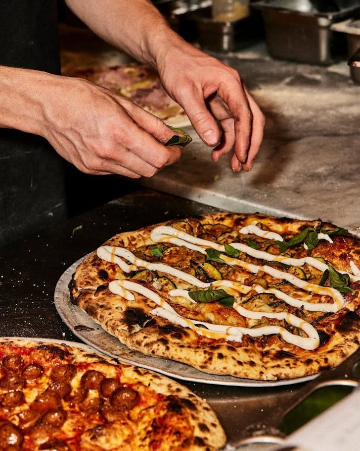 Freshly served pizza at Leonardo's Pizza Place